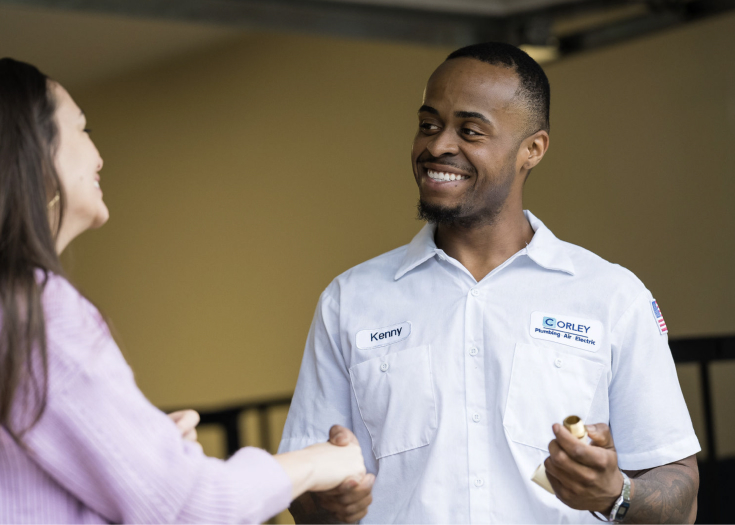 Professional Plumber Talking With a Customer