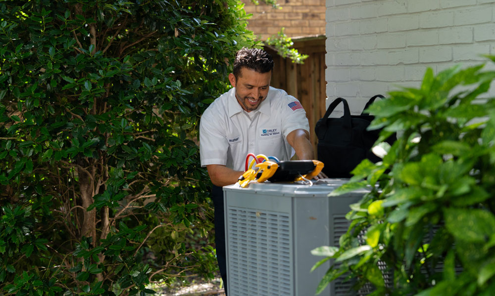 A Professional Fixing an Air Conditioner