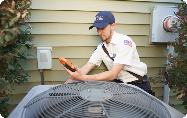 A Professional Fixing an Air Conditioner